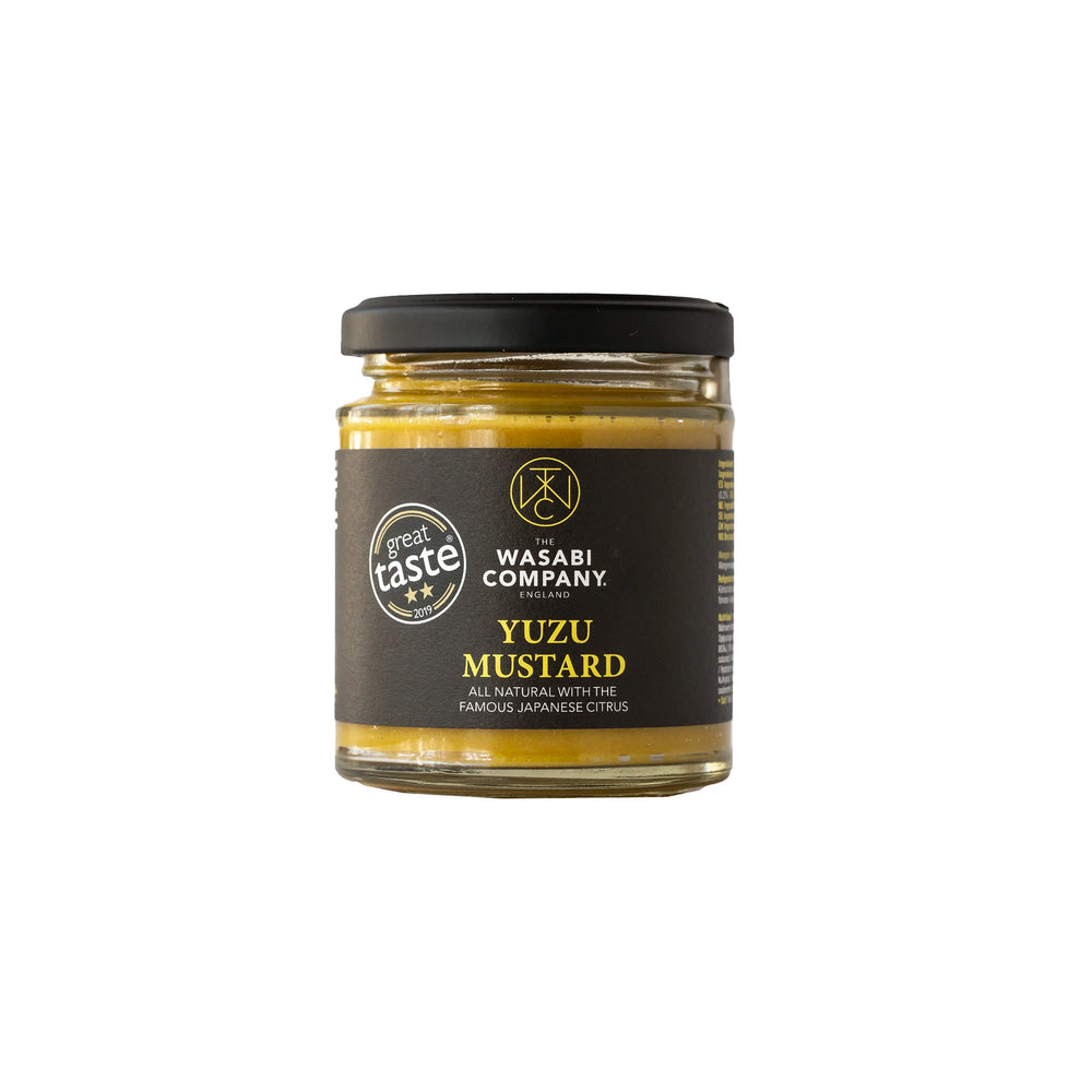 A 175g glass jar of Yuzu Mustard by The Wasabi Company, featuring a black lid and label with product details and an award badge, highlighting its vibrant citrus flavor that earned a Great Taste Award.