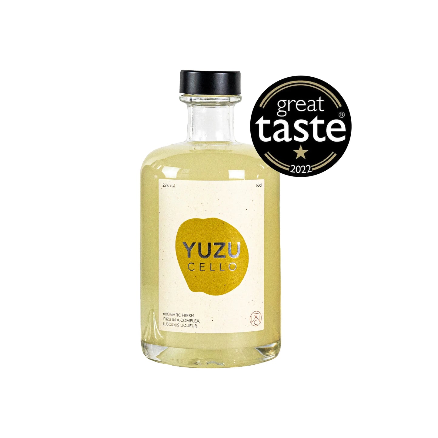 A clear glass bottle labeled Yuzucello - 50cl, filled with pale yellow yuzu liqueur, stands next to a Great Taste 2022 award badge, hinting at its aromatic blend and refreshing citrus notes.