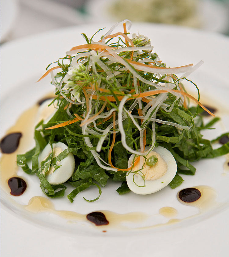 
                  
                    A composed salad with boiled egg, shredded greens, and julienned vegetables, drizzled with balsamic and oil-based dressing, finished with a unique garnish of English Wasabi Baby Leaf - 30g.
                  
                