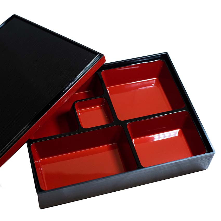 The Bento Box – 5 Section in Black & Red Lacquer features four large compartments and a small central compartment, perfect for packed lunches. Shown with the lid partially open.