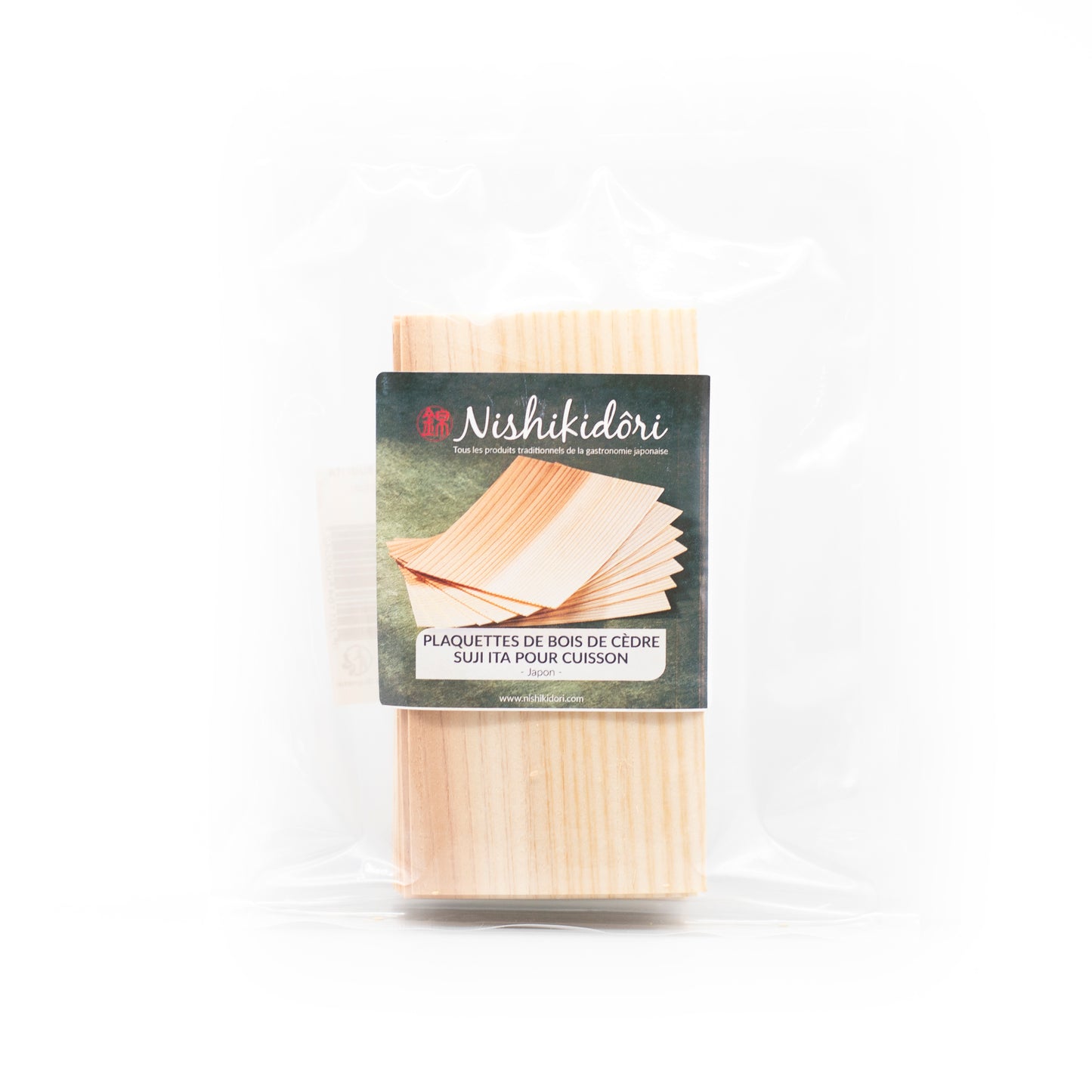 A clear plastic package of Cedarwood Sheets 120x60mm, labeled Nishikidori for cooking, with French text—ideal for adding aromatic flavor when grilling.