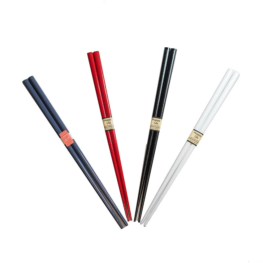 
                  
                    A pair of Zumi Workshop lacquerware chopsticks in black is arranged on a white background.
                  
                