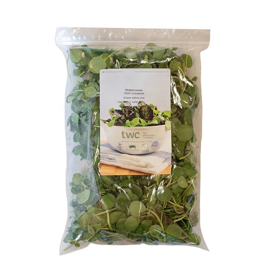 Fresh Watercress: Sealed plastic bag of crisp watercress leaves grown in mineral-rich spring water, featuring product details and an image of salad greens on the front.