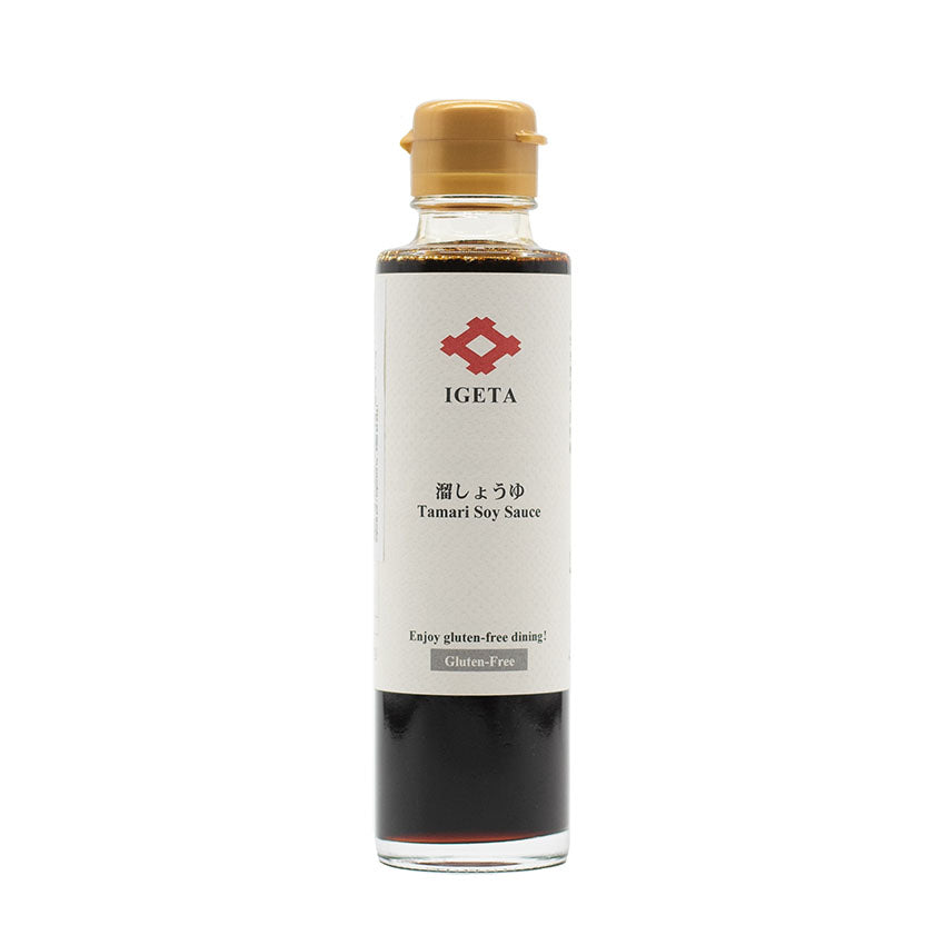 A clear glass bottle of Gluten Free Tamari Soy Sauce from Igeta Shoyu (150ml) with a gold cap and white label featuring Japanese text, traditionally brewed in cedar wood barrels.