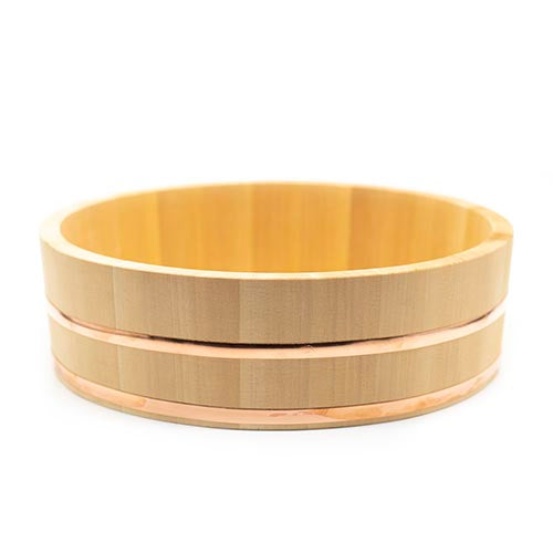 The Hangiri Cypress Wood & Copper Rice Bowl is a round, shallow bowl crafted from smooth Kiso Sawara Cypress wood with two copper bands and sleek sides, shown elegantly on a white background.