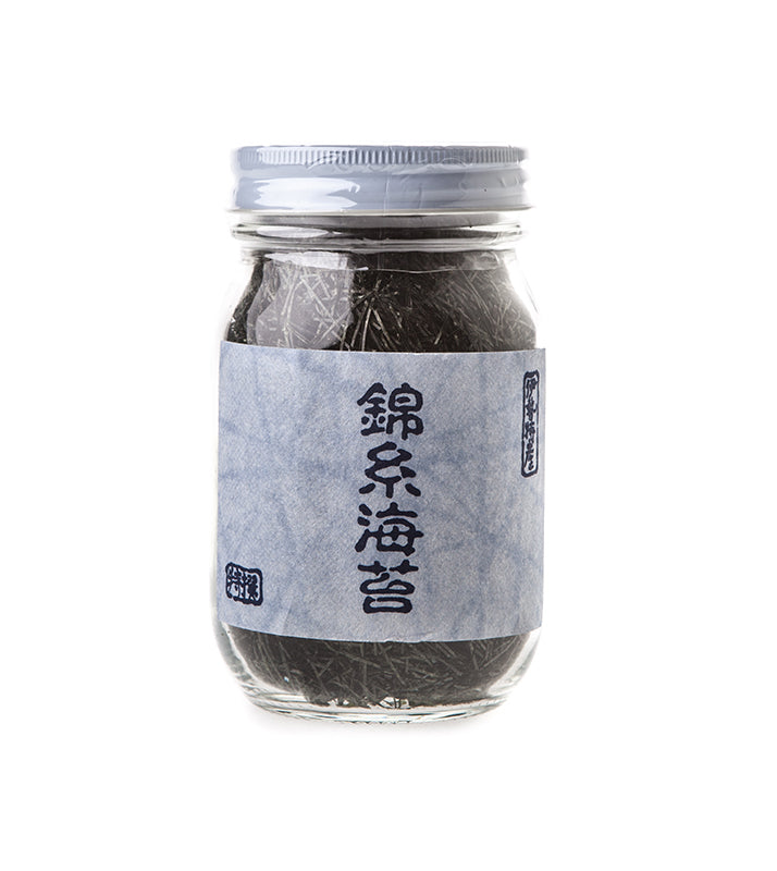 A 30g glass jar of Nori Seaweed Angels Hair Cut, featuring a blue label with Japanese text and containing shredded dried nori from Tôshi island.