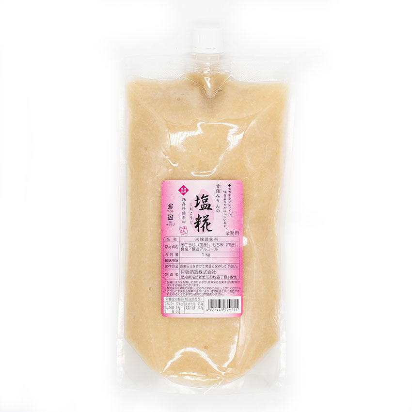 A clear plastic pouch of Shio Koji - 1kg, a light beige paste made with Aspergillus oryzae, features a pink and white Japanese label and top spout—perfect for adding umami flavour to your dishes.
