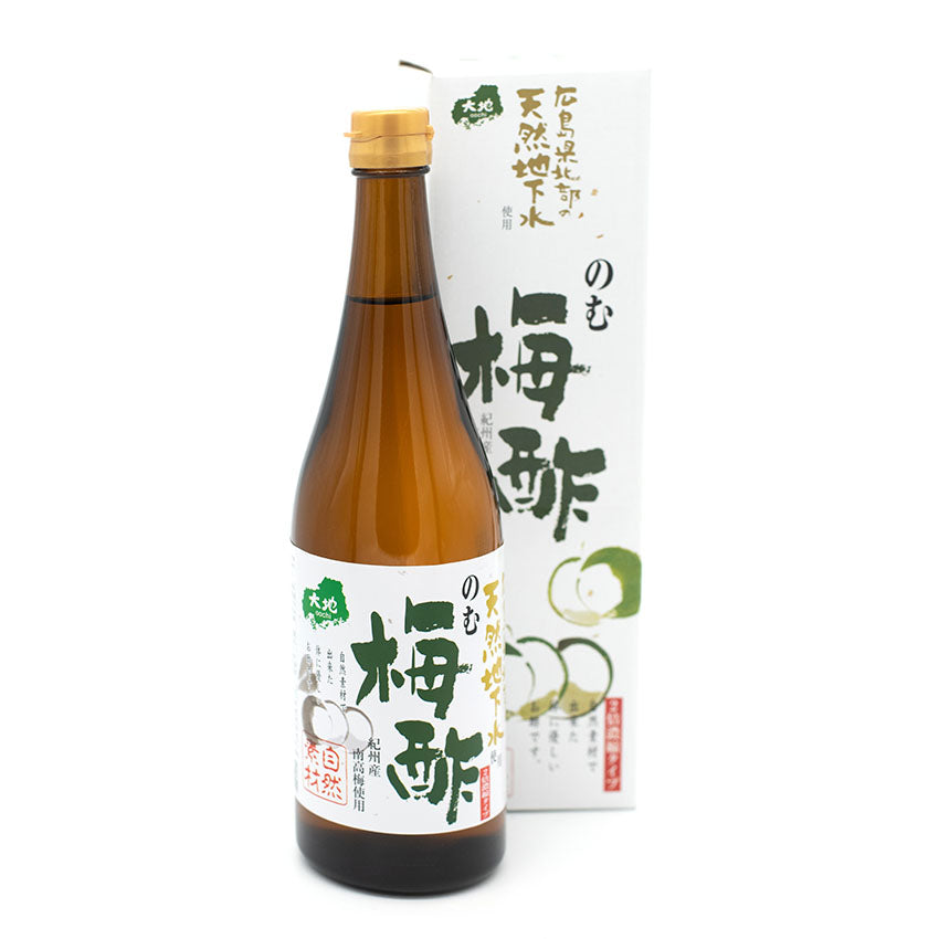 
                  
                    A brown glass bottle of Ume Plum Drinking Vinegar with a white label sits before its matching box, which displays green and black Japanese characters and fruit images, emphasizing the health benefits of Japanese plum.
                  
                