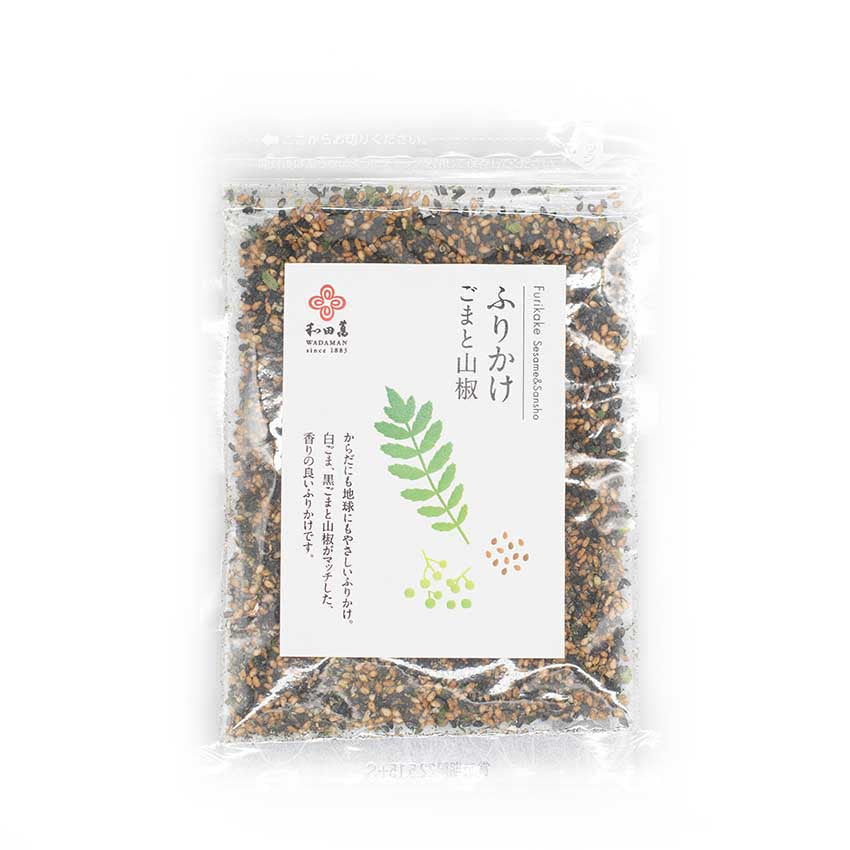 A clear plastic package of Wadaman Furikake Sesame & Sansho Pepper 30g features a white label with green plant illustrations and Japanese text; the seasoning includes sesame seeds and sansho pepper.