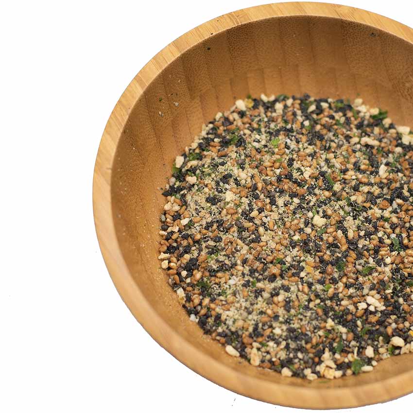 
                  
                    A wooden bowl holds Wadaman Organic Furikake Sesame & Yuzu 25g, a dry blend of sesame seeds, dried seaweed, yuzu, and spices.
                  
                