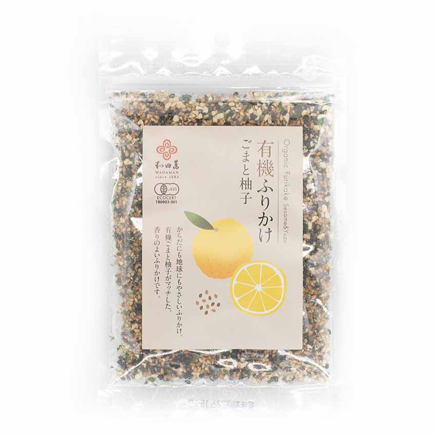 A clear pouch of Wadaman Organic Furikake Sesame & Yuzu 25g, featuring Japanese text and a yellow citrus illustration on the label.