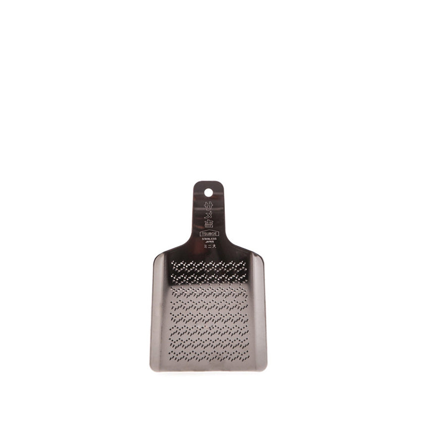 The Wasabi Stainless Steel Grater - Extra Small is a flat, rectangular grater with a handle and sharp holes, perfect for grating fresh wasabi.