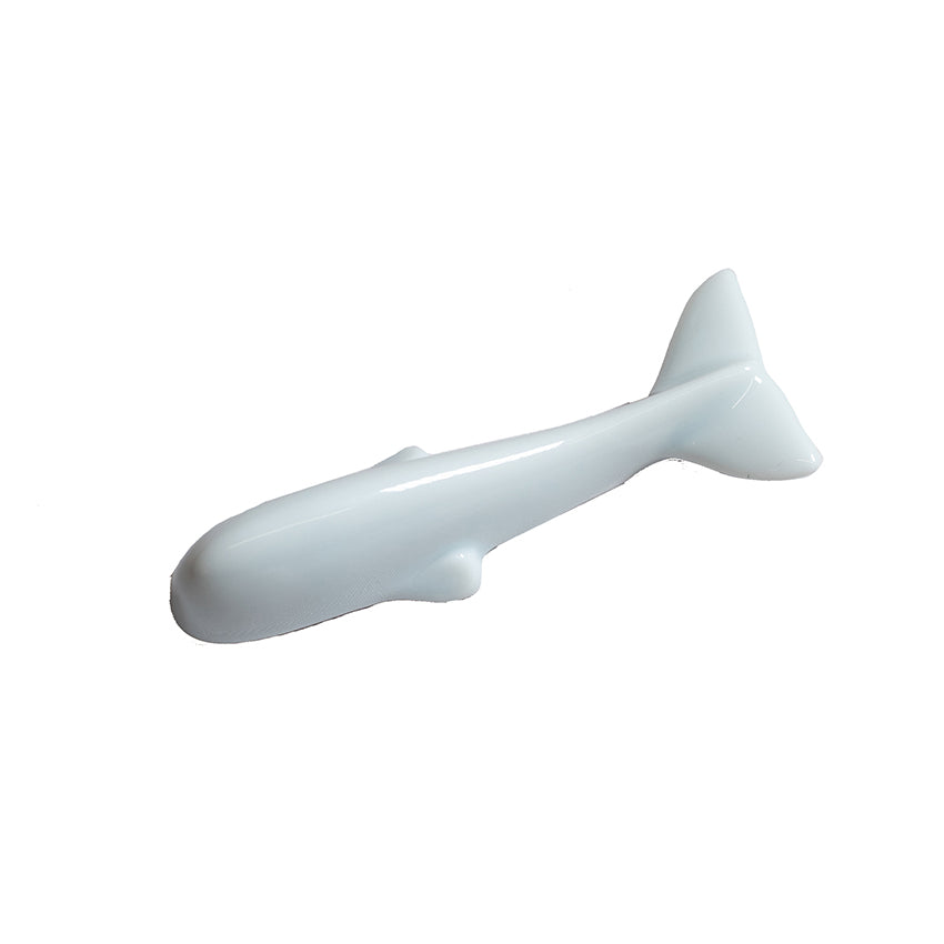 The Whale Chopstick Rest - White, crafted from smooth Minoyaki porcelain and shaped like a fish, is displayed on a plain white background—ideal as a white whale-shaped chopstick rest.