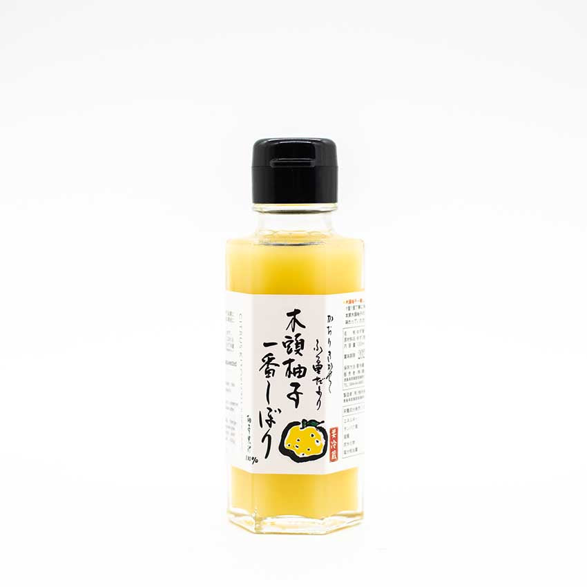 Fresh Yuzu Juice from Kito comes in a small glass bottle with a black screw cap and a label displaying Japanese text and a citrus fruit illustration—ideal for savoring the vibrant, zesty taste of authentic yuzu juice.